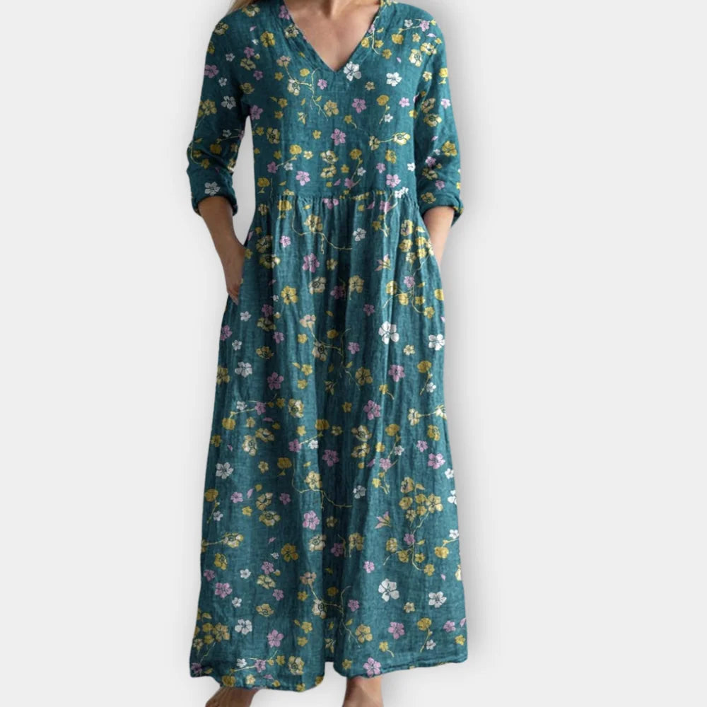 Grünes Damen Boho Maxikleid mit Blumenmuster, leichtes Material, perfekt für den Sommer, lang und luftig.