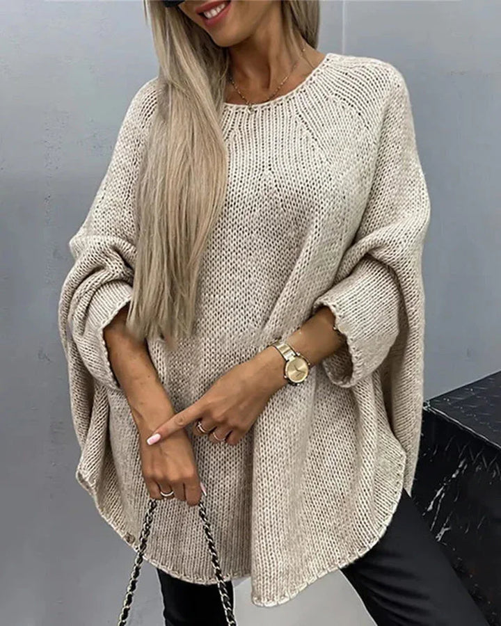 Beiger Damen Cape-Strickpullover mit weiten Ärmeln, aus weichem Baumwollmix, ideal für lässige Herbstlooks.