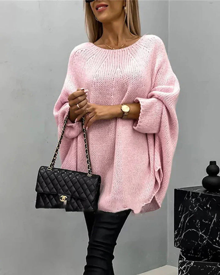 Rosa Damen Cape-Strickpullover mit weiten Ärmeln, aus weichem Material, ideal für lässige Freizeitlooks.