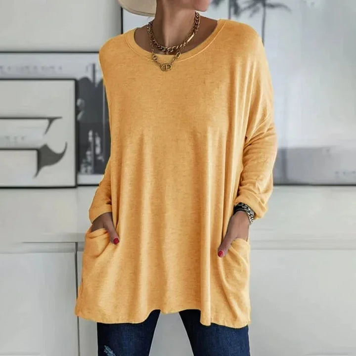 Gelber Damen Oversize Pullover mit Rundhalsausschnitt, praktischen Taschen und weichem, angenehmem Material für Komfort.