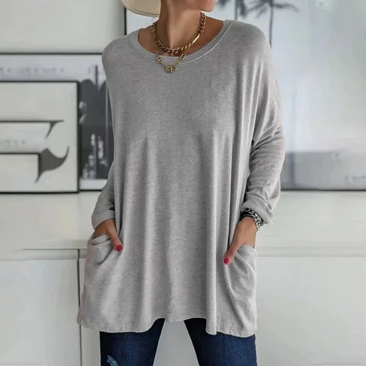 Grau Damen Oversize Pullover aus weichem Material mit Rundhalsausschnitt und praktischen Taschen für lässigen Komfort.