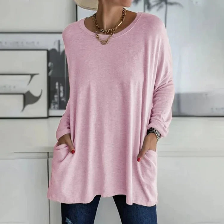 Rosa Damen Oversize Pullover aus weichem Material mit Rundhalsausschnitt und praktischen Taschen für entspannte Looks.