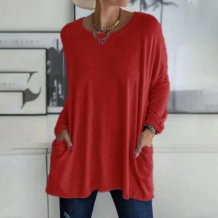 Damen Oversize Pullover in Rot, aus weichem Baumwollmix, mit Rundhalsausschnitt und praktischen Seitentaschen.