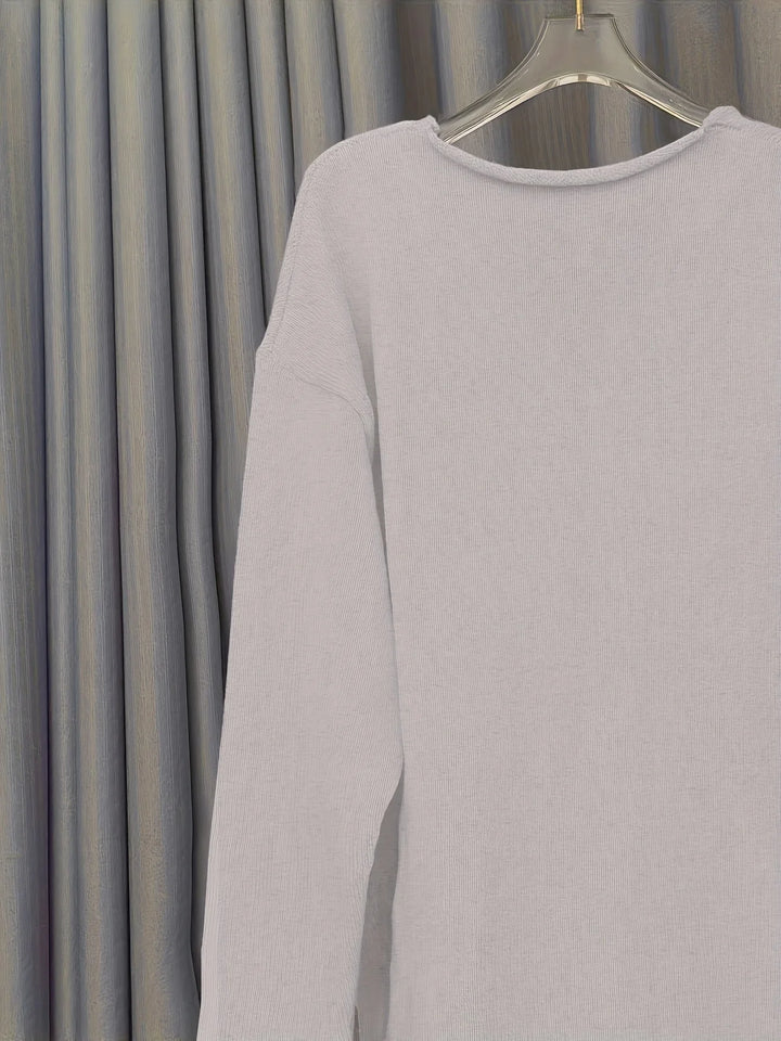 Damen Oversize Pullover aus weichem Baumwollgemisch, V-Ausschnitt, lässiger Schnitt und auffälliger Statement-Print.