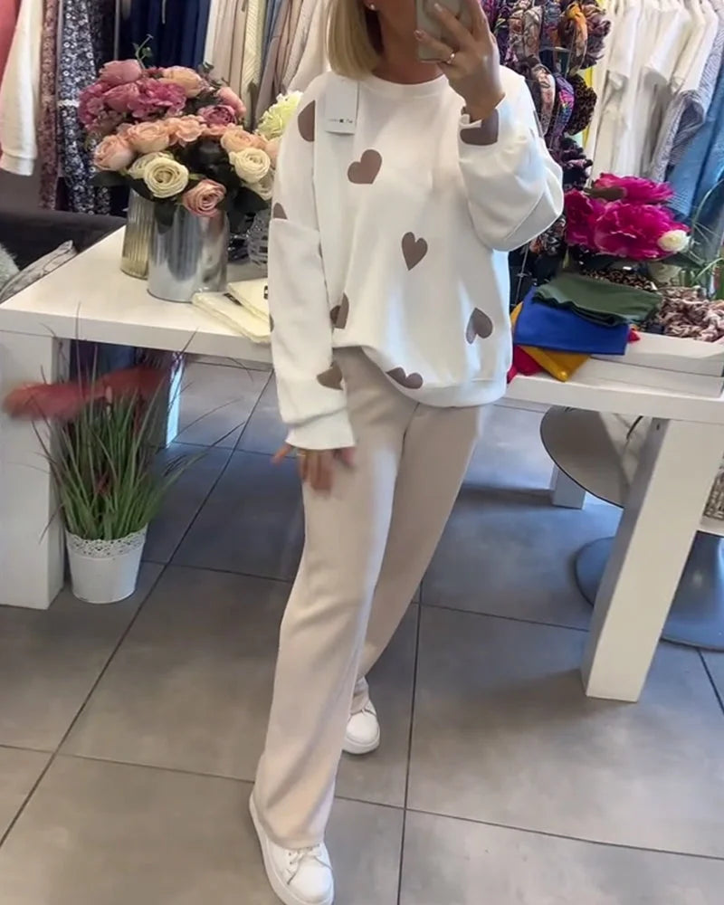 Damen Pullover aus Baumwollmix mit Herzmuster, bequemer Schnitt und weichem Material, ideal für legeren Alltag.