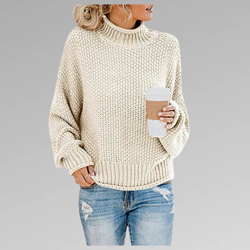 Damen Strickpullover in Creme mit Rollkragen, langen Ärmeln und feinem Strickmuster für gemütlichen Tragekomfort.