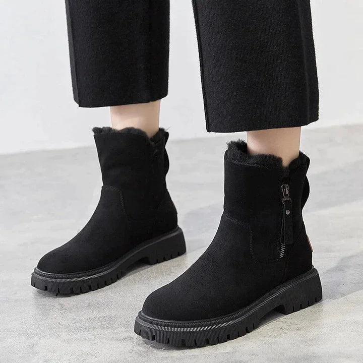 Damen-Winterboots aus wasserabweisendem Material, mit warmem Futter und rutschfester, robuster Sohle für bessere Griffigkeit.