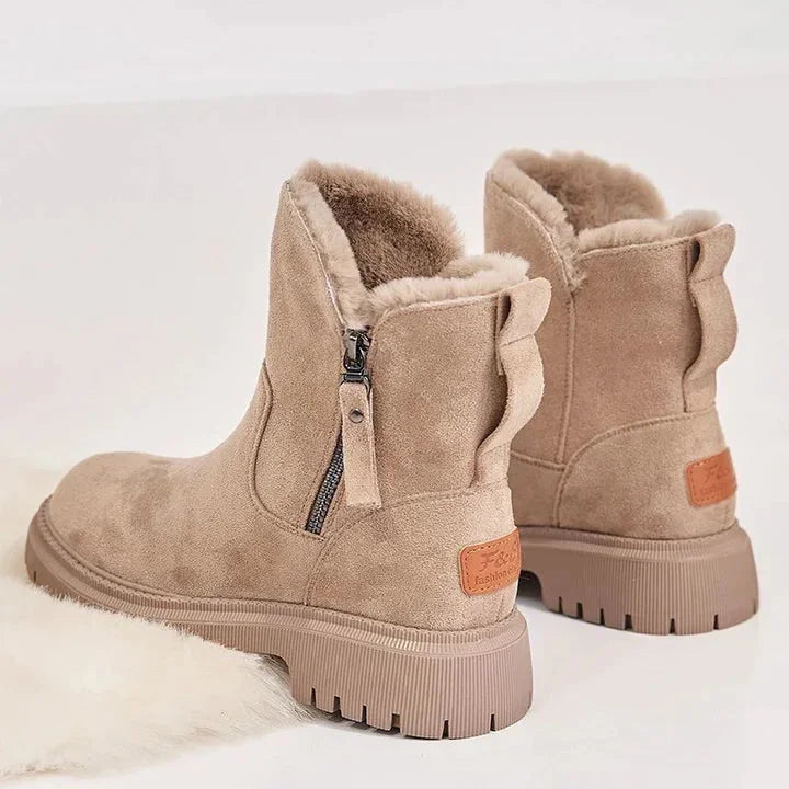 Damen-Winterboots aus strapazierfähigem Material mit warmem Futter und rutschfester, robuster Sohle für winterlichen Komfort.