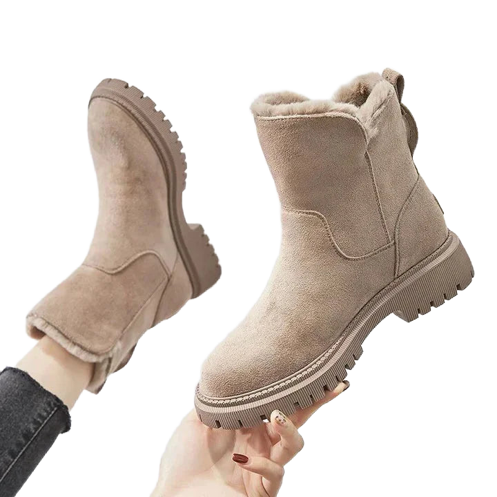 Beige Damen-Winterboots aus robustem Material mit warmem Futter und griffiger Gummisohle für optimalen Halt.