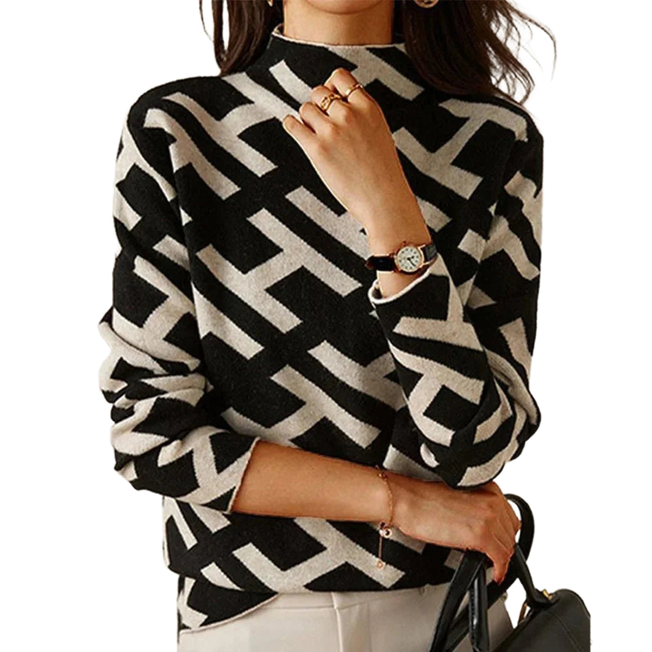 Schwarzer Damenpullover mit geometrischem Muster in Schwarz-Weiß aus weichem Material, ideal für den lässigen Alltag.