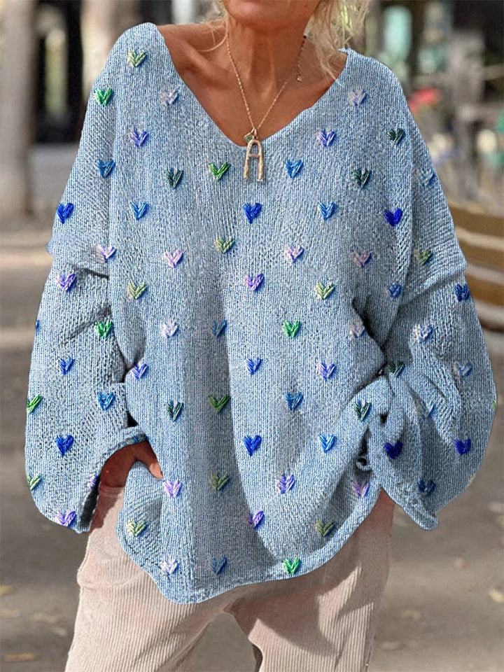 Damenpullover in Blau mit Herzdesign, leichter Strickqualität und lockerer Passform für einen lässigen Look.