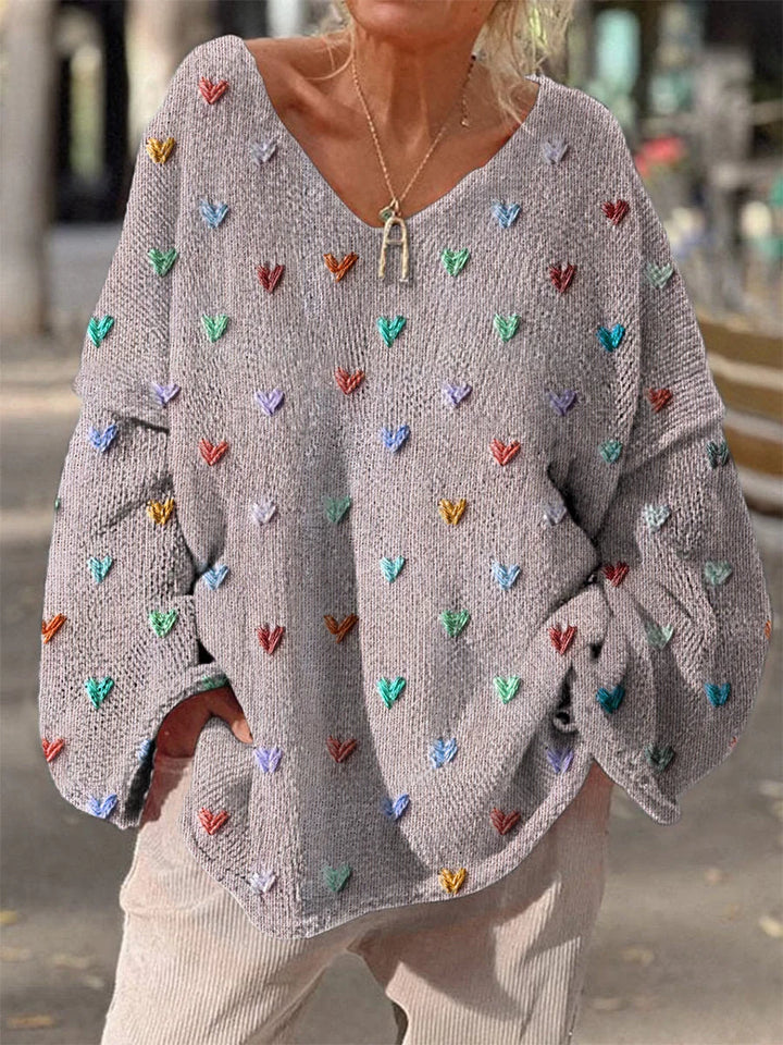 Lila Damenpullover aus Baumwolle mit Herzdesign und lockerer Passform für comfortables Tragen im Alltag.