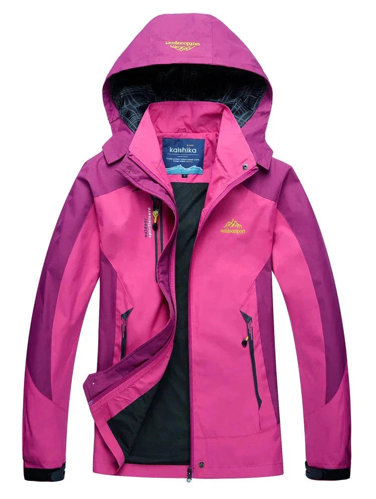 Rosa wasserabweisende Outdoor-Jacke aus leichtem Material mit abnehmbarer Kapuze und praktischen Taschen für den Alltag.