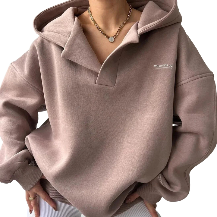 Damen Kapuzenpullover in Rosa, aus weichem Material, lässiger Schnitt und bequeme Kapuze für kalte Wintertage.