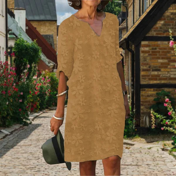Damen A-Linien Kleid in Khaki mit Blumenmuster, V-Ausschnitt und leichtem Stoff - elegantes, feminines Design für den Sommer.