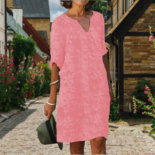 Rosa Damen A-Linien Kleid mit Blumenmuster und V-Ausschnitt, ideal für den Sommer. Aus leichtem Stoff für Komfort und…