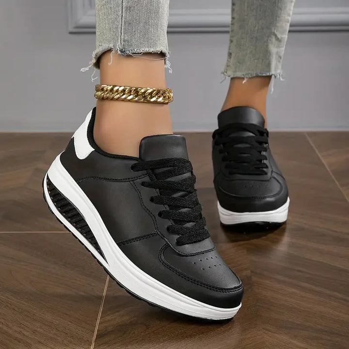 Schwarze Damen Air Cushion Sneakers mit atmungsaktivem Mesh-Design und moderner Sohle.
