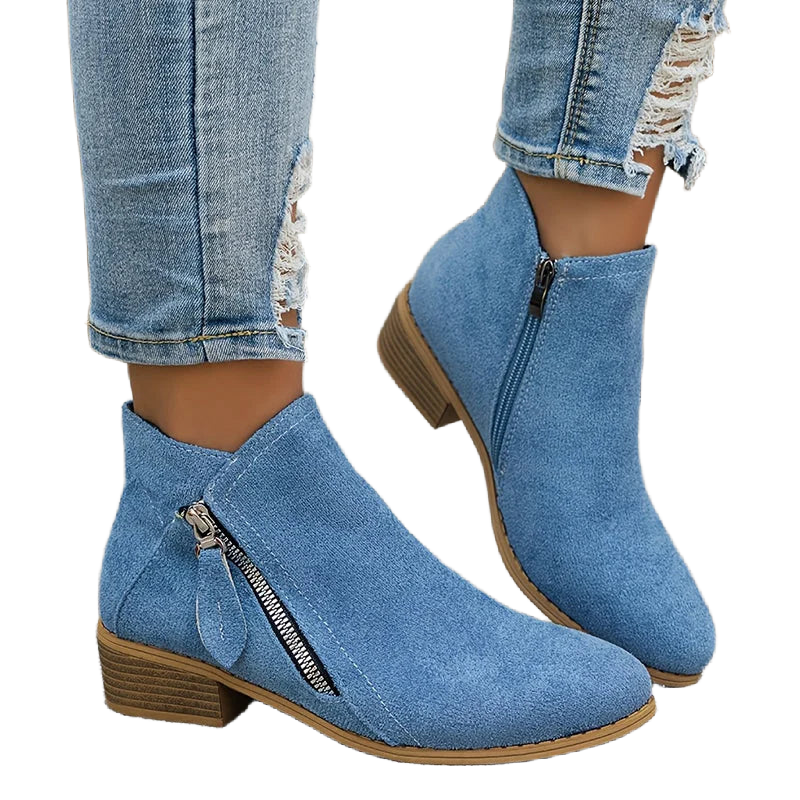 Damen Ankelstiefel aus schwarzem Leder mit seitlichem Reißverschluss und flachem Absatz für einen modernen Look.