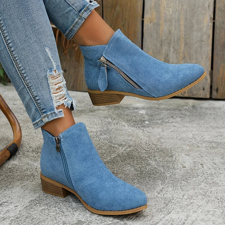 Damen Ankelstiefel mit seitlichem Reißverschluss aus hochwertigem Leder in klassischem Design und bequemer Passform.