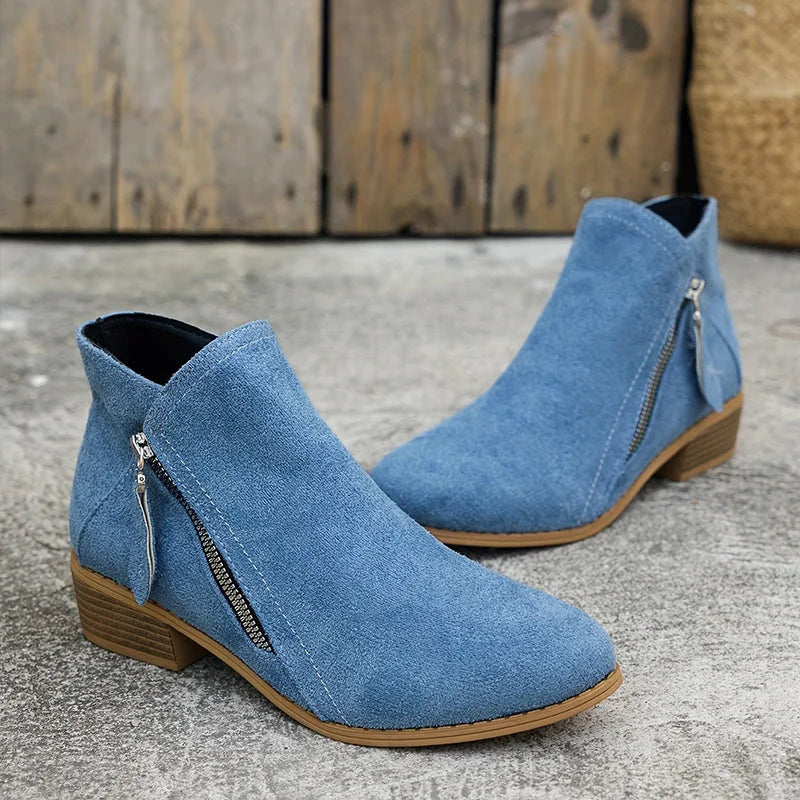 Damen Ankelstiefel aus Leder mit seitlichem Reißverschluss und schlichter, eleganter Silhouette für vielseitige Outfits.