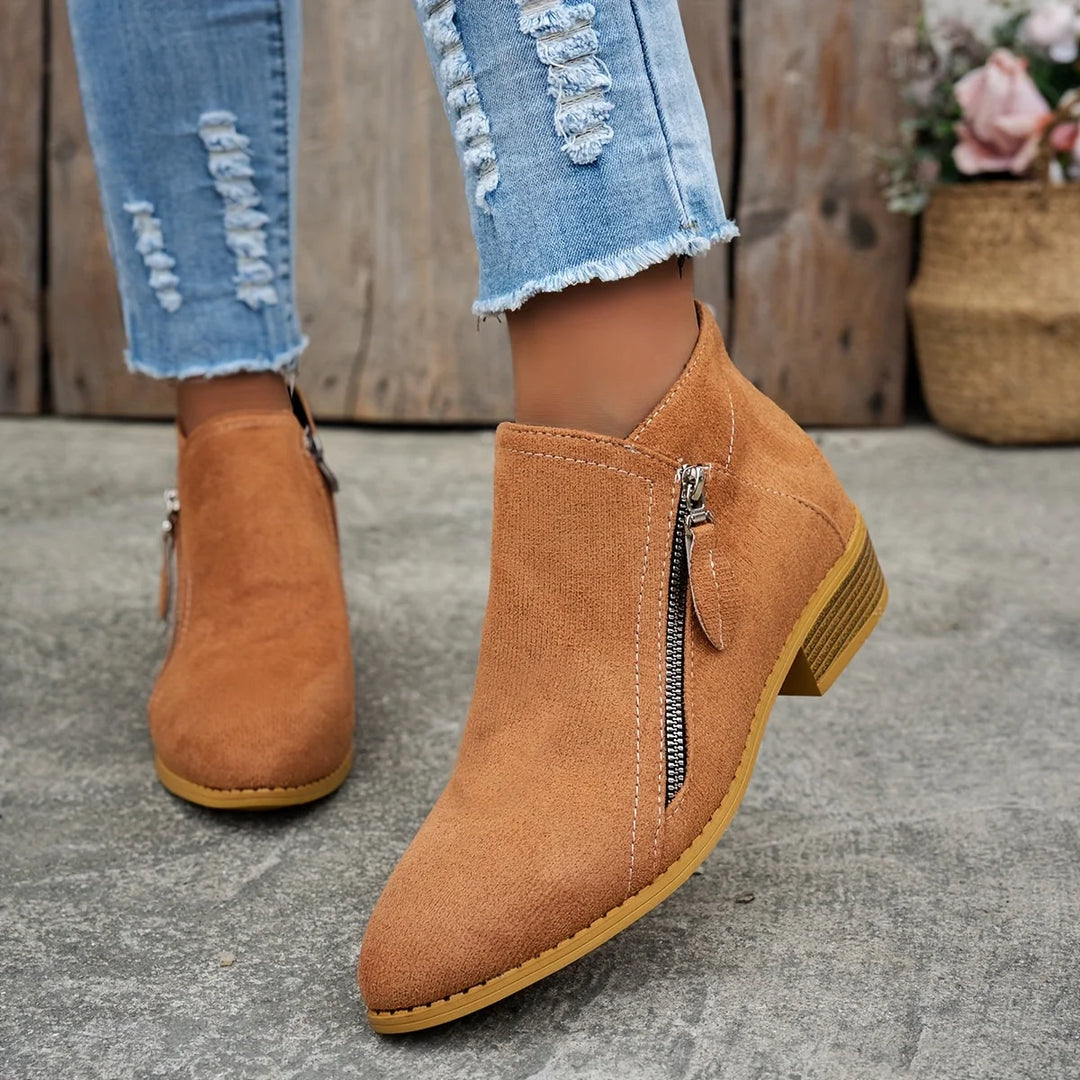 Damen Ankelstiefel aus Kunstleder mit seitlichem Reißverschluss und modischem, schlichten Design für vielseitige Anlässe.