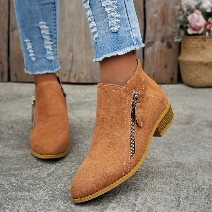 Damen Ankelstiefel aus Kunstleder mit seitlichem Reißverschluss und modischem, schlichten Design für vielseitige Anlässe.