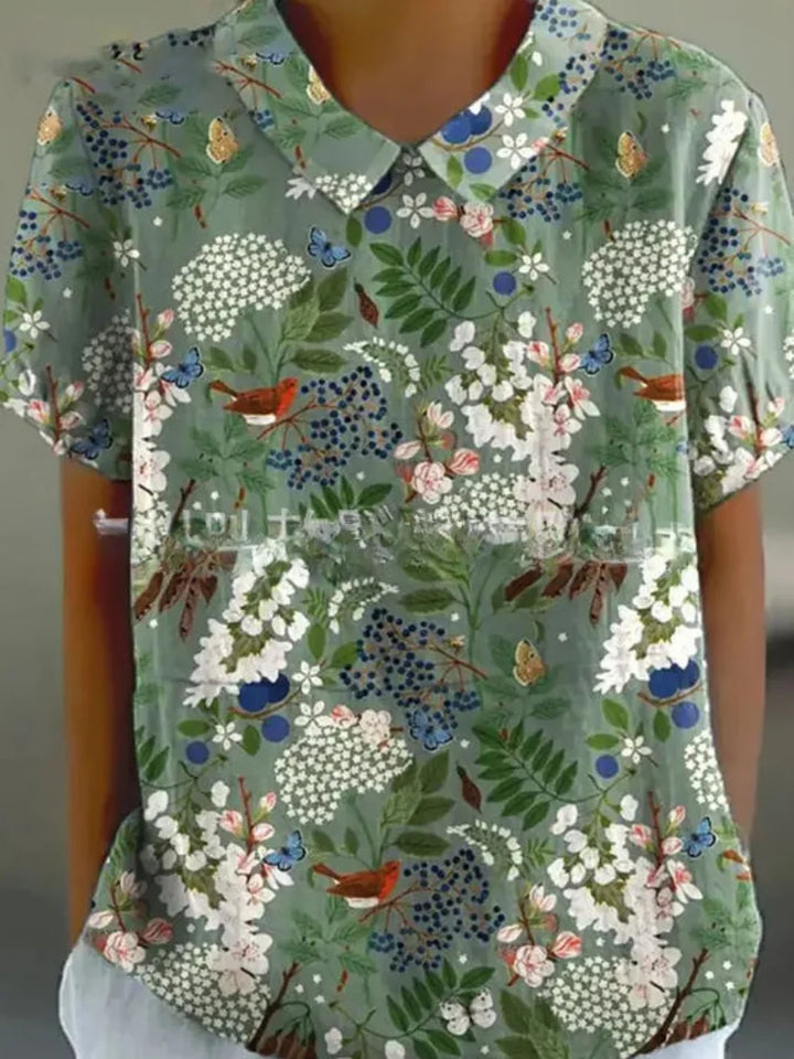 Damen Bluse aus leichtem Stoff mit floralem Stickmuster und kurzen Ärmeln für den Sommerlook.