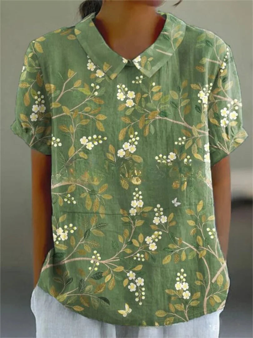 Grüne Damenbluse mit floralem Stickmuster und kurzen Ärmeln - feminines Design, perfekt für den Sommer, aus hochwertigem…