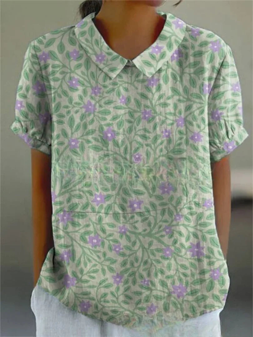 Damen Bluse aus Baumwolle in Grün mit floralem Stickmuster und kurzen Ärmeln, perfekt für den Frühling und Sommer.
