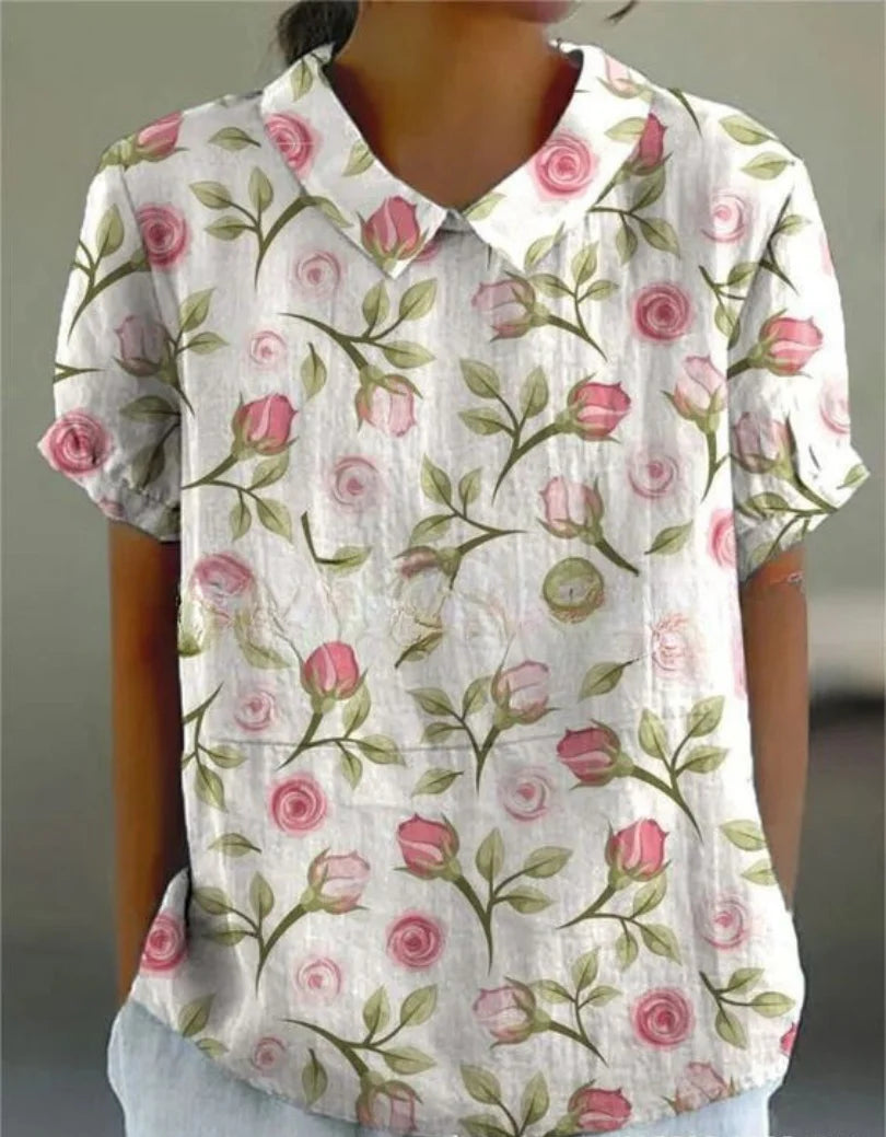 Weiße Damenbluse mit floralem Stickmuster und kurzen Ärmeln, perfekt für den Frühling und Sommer, aus leichtem und…