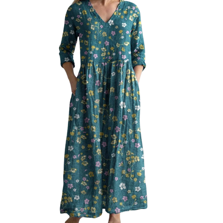 Grünes Damen Boho Maxikleid mit Blumenmuster, leichtes Material, perfekt für den Sommer, lang und luftig.