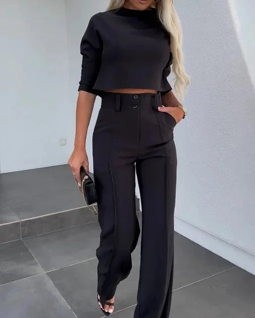 Damen Zweiteiliges Set in Schwarz, bestehend aus weitem Bein Kleid und passender Bluse, aus atmungsaktivem Material.