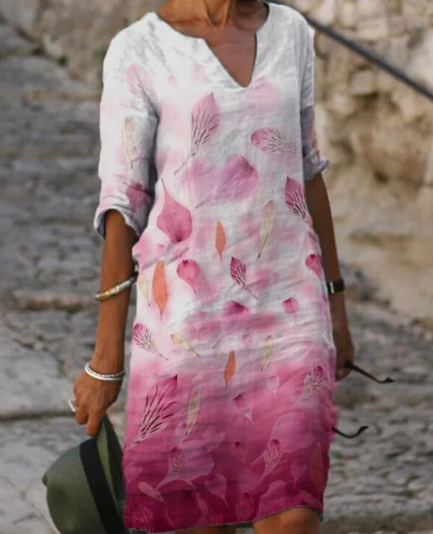 Damen Freizeitkleid in Weiß-Rosa mit Blumenmuster, 3/4-Ärmeln, leichtem Stoff, ideal für den Sommer.