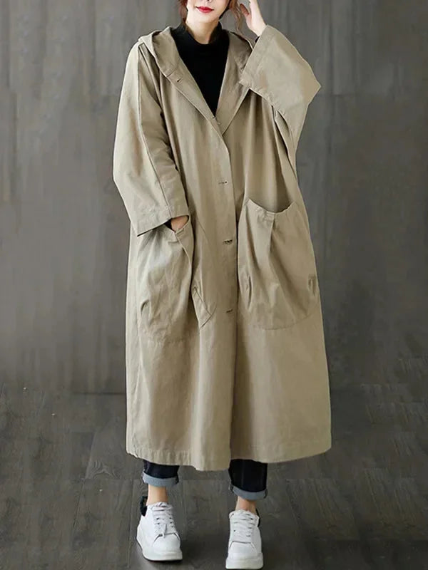 Damen Kapuzen-Trenchcoat aus robustem Material mit großen Taschen und knielanger Schnittführung für praktischen Tragekomfort.