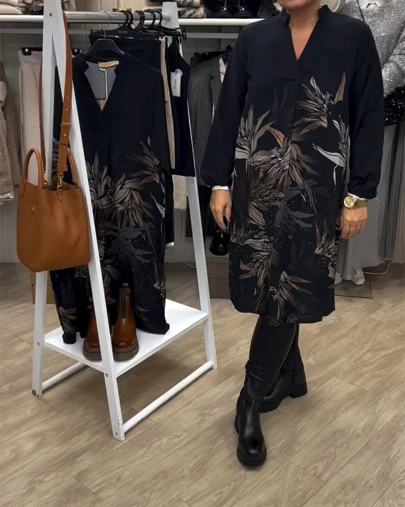 Damen Langarm Midi Kleid aus leichtem Stoff, mit floralem Muster in Schwarz, ideal für den Alltag und besondere Anlässe.