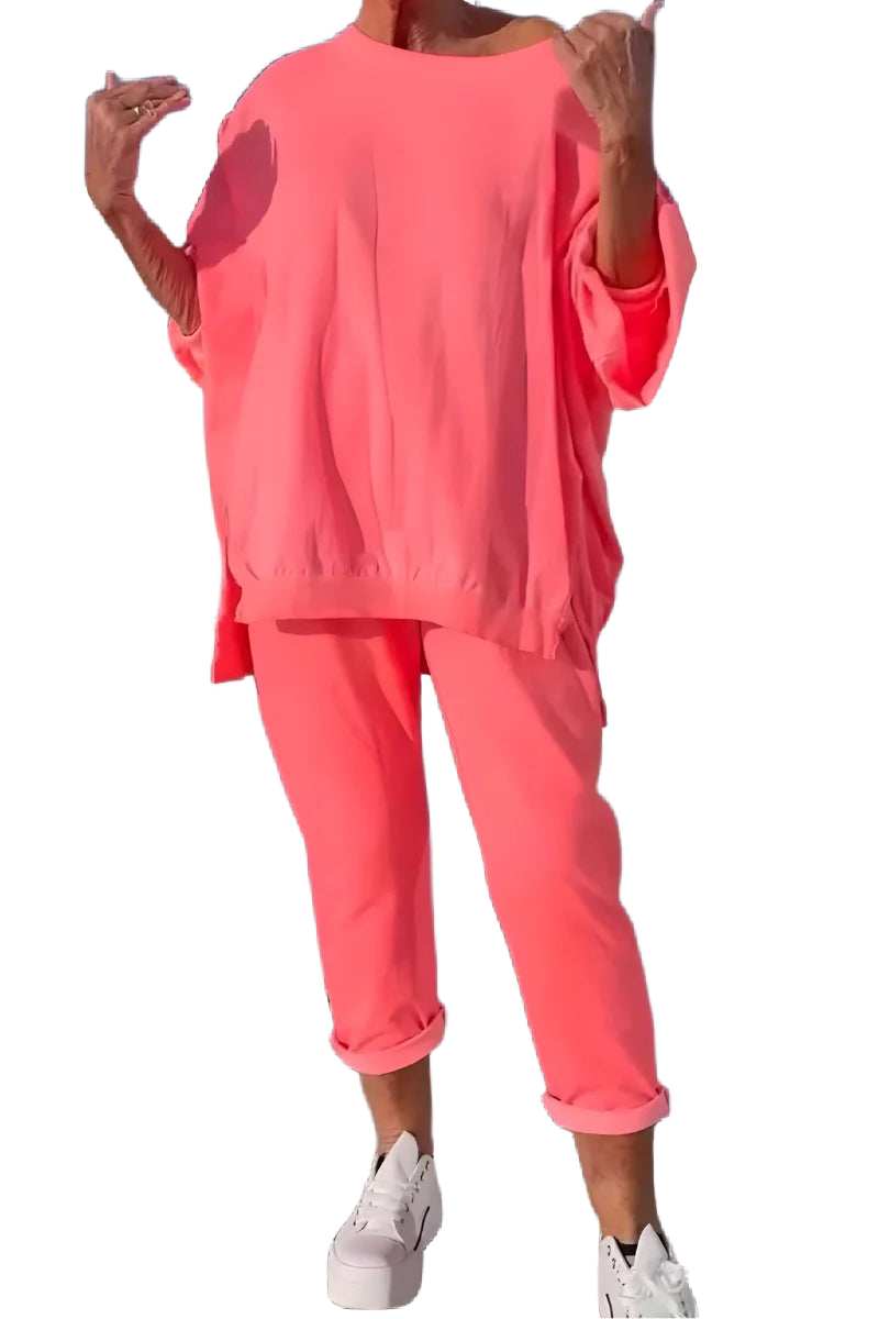 Rosa Damen Loungewear-Set aus weichem Material mit oversized Top und bequemer Jogginghose für entspannte Tage.
