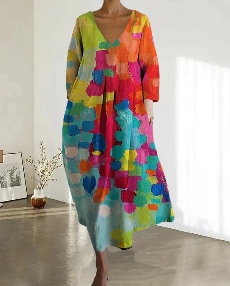 Damen Midi-Kleid mit buntem Print und V-Ausschnitt aus leichtem Stoff, ideal für den Sommer.