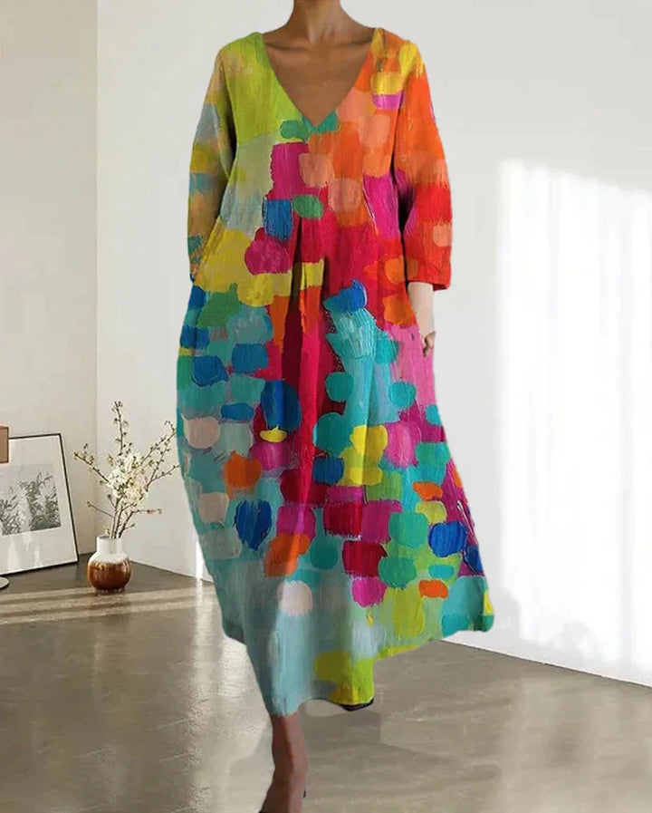 Damen Midi-Kleid mit buntem Print und V-Ausschnitt aus leichtem Stoff, ideal für den Sommer.