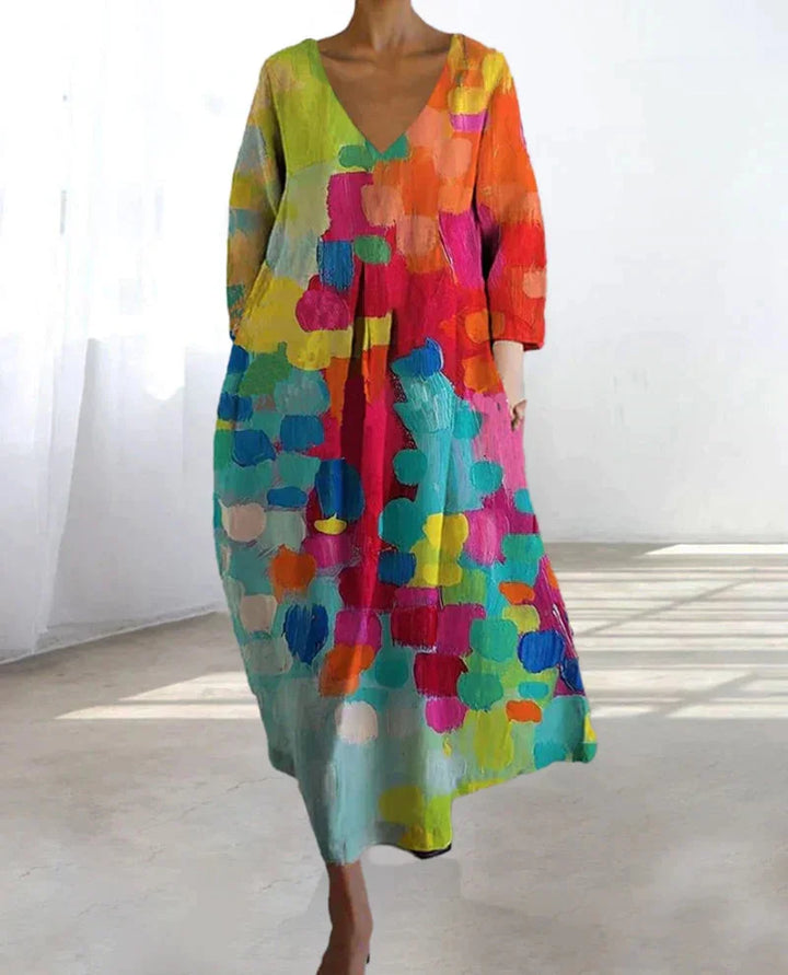 Damen Midi-Kleid aus leichtem Stoff mit bunter Musterung und V-Ausschnitt, perfekt für den Alltag oder besondere Anlässe.