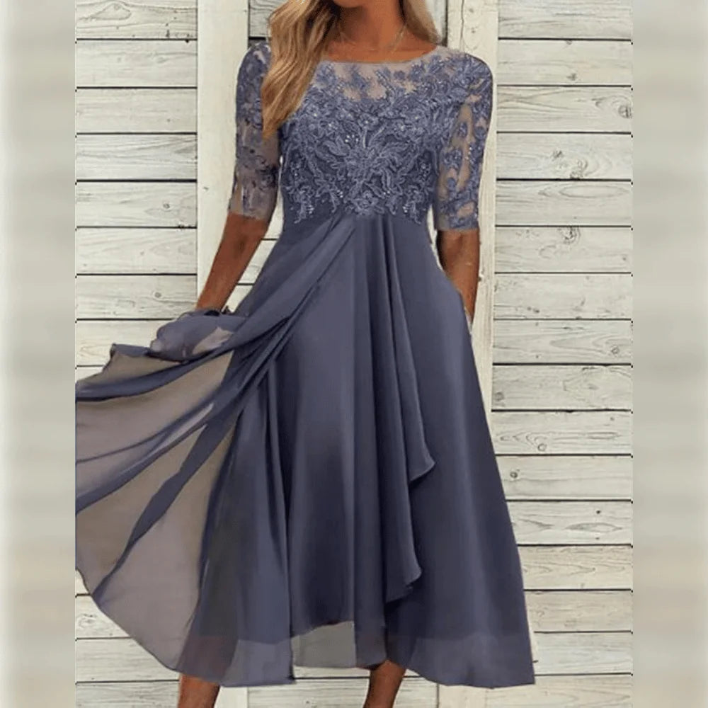 Graues Damen Midi-Kleid mit Spitzenoberteil und asymmetrischem Saum, ideal für festliche Anlässe oder elegante Events.