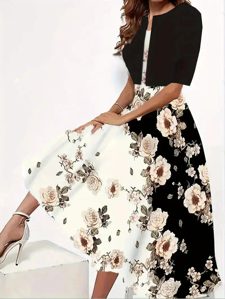 Damen Midi-Sommerkleid aus leichtem Stoff mit Blütenmuster, dazu passender Blazer - perfekt für sommerliche Anlässe.