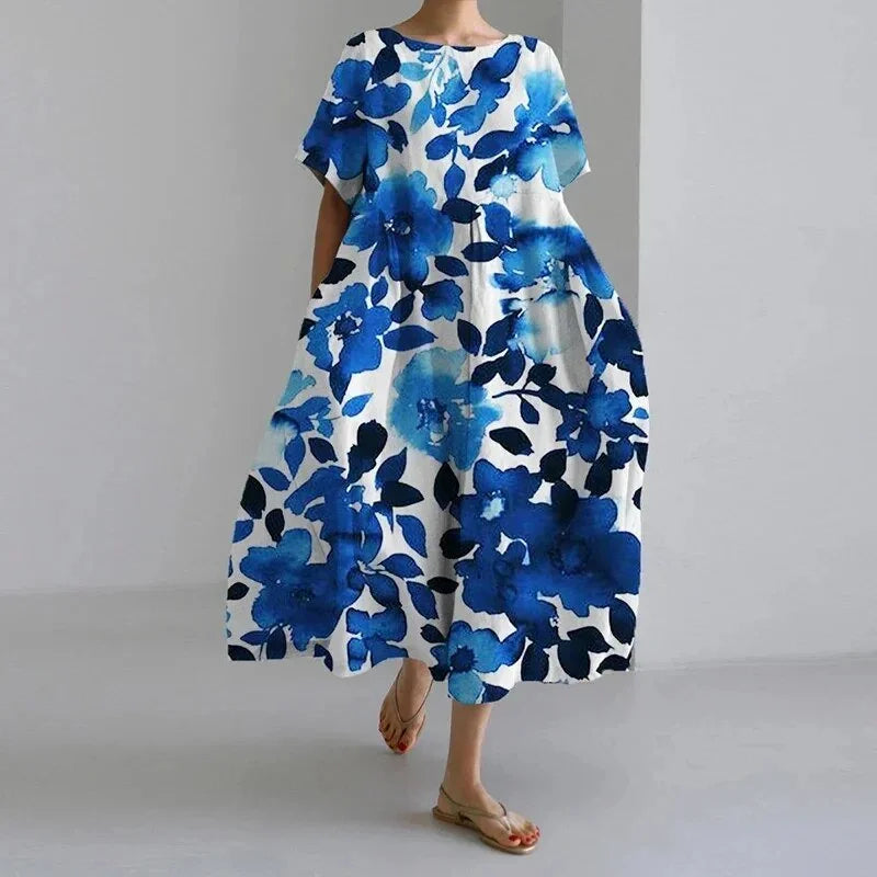 Damen Midikleid mit Blumenmuster in Blau und Weiß, leichtes und atmungsaktives Material, perfekt für den Sommer.