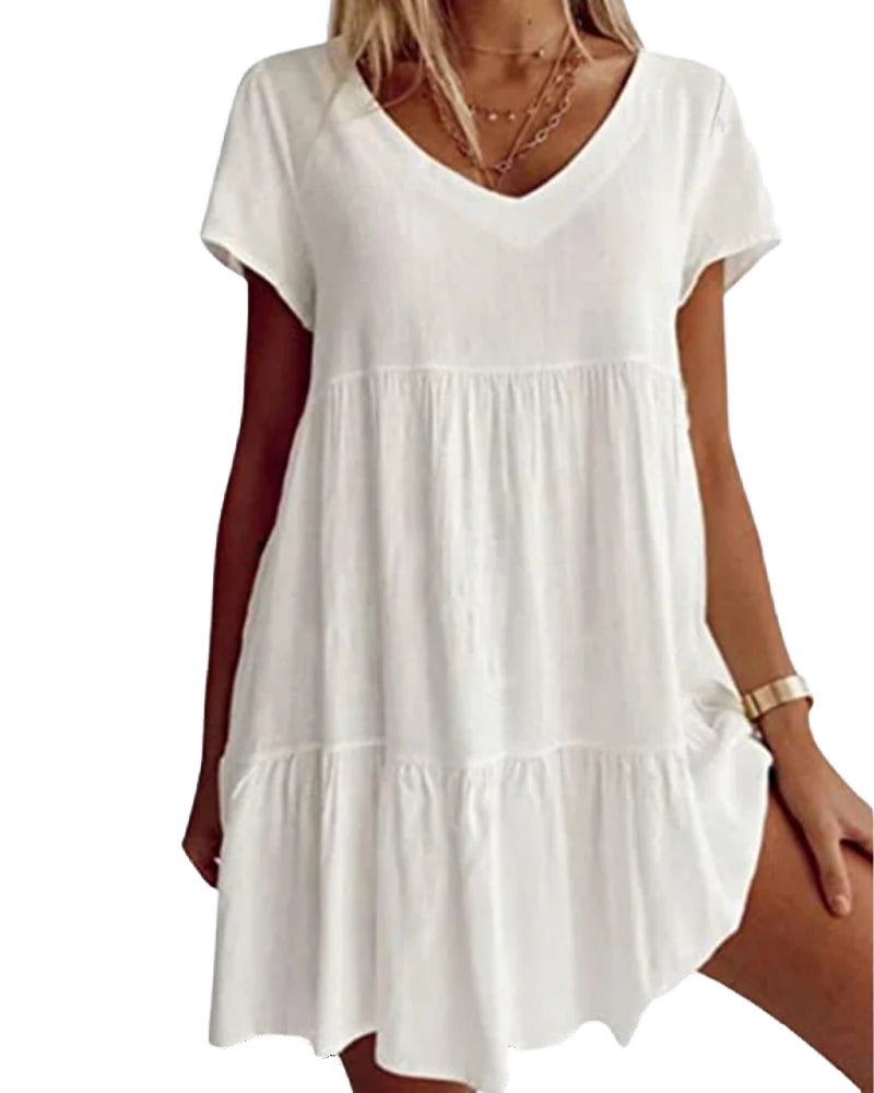 Weißes Leinenkleid für Damen mit V-Ausschnitt, Rüschen und Kurzarm. Leicht und luftig, perfekt für den Sommer.