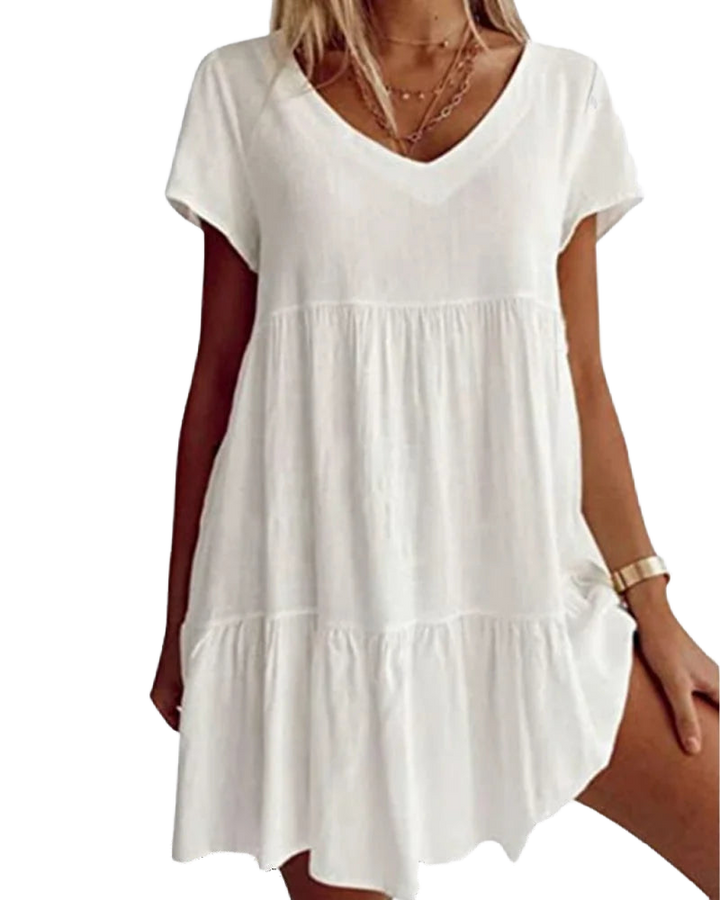 Weißes Leinenkleid für Damen mit V-Ausschnitt, Rüschen und Kurzarm. Leicht und luftig, perfekt für den Sommer.