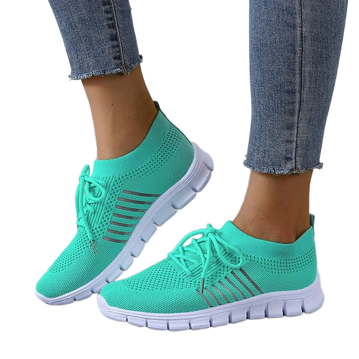 Graue Orthopädische Damen-Sneakers mit atmungsaktivem Netzgewebe für Komfort und Stil unterwegs.