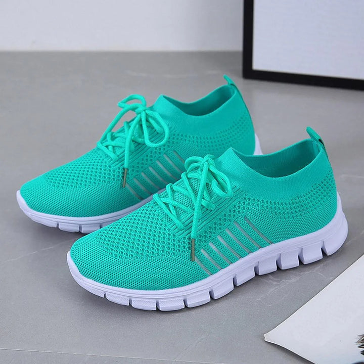 Orthopädische Damen-Sneakers mit atmungsaktivem Netz, bequemer Passform und modernem Design.