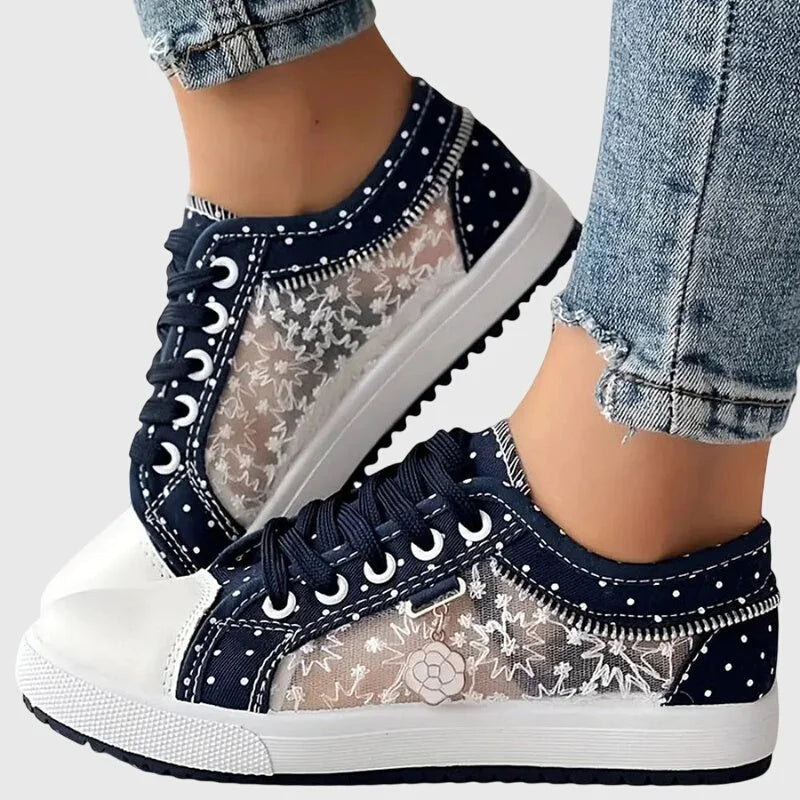 Damen Orthopädische Sneakers in Marineblau mit Blumendetail, aus atmungsaktivem Material und bequemem Fußbett.