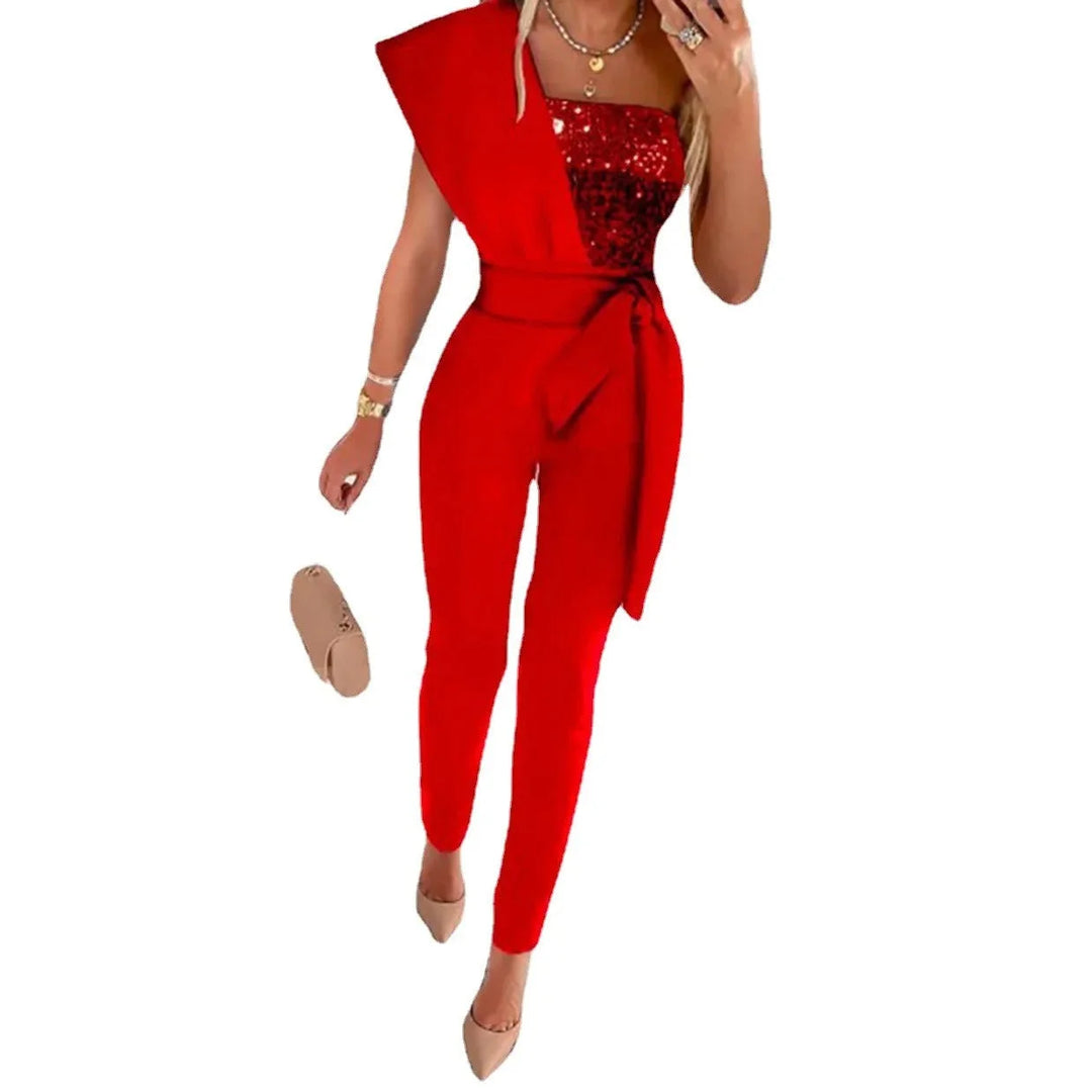 Schwarzer Damen Overall aus Polyester mit glitzerndem Pailletten-Oberteil und Stoffgürtel.