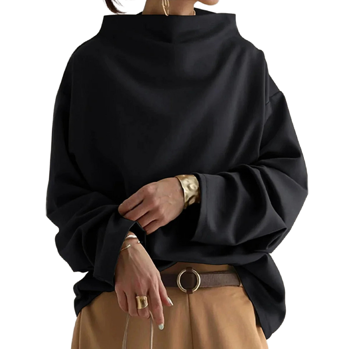 Damen Oversize Rollkragenpullover in Schwarz, aus weichem, atmungsaktivem Material mit geripptem Kragen und lässigem Schnitt.