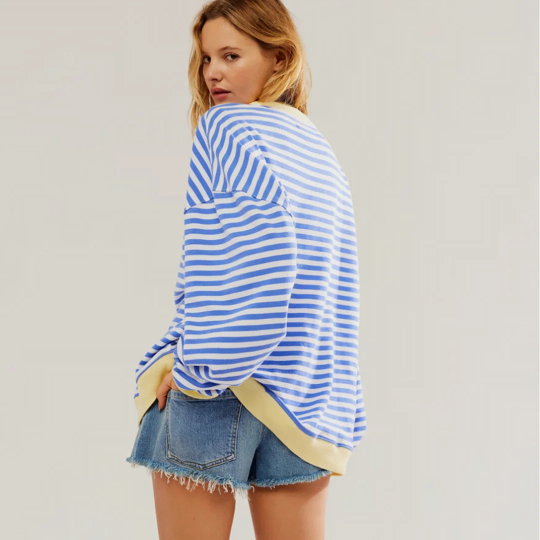 Damen Oversized Strickpullover aus weichem Material mit buntem Streifenmuster und lässigem Schnitt für Komfort und Stil.